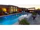 Backyard pool area featuring a beautiful backyard pool, lounge chairs and outdoor seating, with a covered patio at 10507 S 181St Ave, Goodyear, AZ 85338