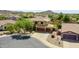An aerial shot highlights the front of the house with a three-car garage and neat landscaping at 11150 S Star Ct, Goodyear, AZ 85338