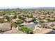 An elevated view of a residential neighborhood with desert landscaping and mountain views beyond at 11150 S Star Ct, Goodyear, AZ 85338