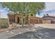 Attractive two-story house with three-car garage, desert landscaping, and a welcoming front entrance at 11150 S Star Ct, Goodyear, AZ 85338