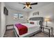 Inviting bedroom features a plush bed, soft carpet, ceiling fan, and bedside lamps at 1142 E Westchester Dr, Tempe, AZ 85283