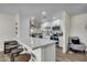 Bright and airy kitchen featuring white cabinets, stainless steel appliances, and a breakfast bar with stools at 1142 E Westchester Dr, Tempe, AZ 85283