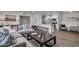 Open concept living room with modern furnishings, seamlessly connected to the kitchen and dining areas at 1142 E Westchester Dr, Tempe, AZ 85283