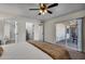 Relaxing main bedroom showcasing a cozy bed, sliding glass door, and en-suite bathroom entrance at 1142 E Westchester Dr, Tempe, AZ 85283