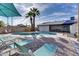 A stunning outdoor oasis with a shimmering pool, stylish lounge chairs, and shade at 1142 E Westchester Dr, Tempe, AZ 85283