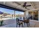 Inviting outdoor patio features a dining table with a view of the sparkling pool at 1142 E Westchester Dr, Tempe, AZ 85283