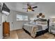 Charming bedroom featuring a ceiling fan and decorative wall art at 1209 E Marigold Ln, Tempe, AZ 85288