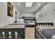 A spacious bedroom with wood-look flooring and 3 beds is perfect for or guests at 1209 E Marigold Ln, Tempe, AZ 85288