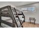 bedroom with wooden bunk beds and wood-look tile floors for easy cleaning at 1209 E Marigold Ln, Tempe, AZ 85288