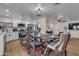 Open dining area next to a modern kitchen featuring stainless steel appliances at 1209 E Marigold Ln, Tempe, AZ 85288