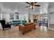 Bright living room with modern furnishings, a fireplace, and access to the backyard at 1209 E Marigold Ln, Tempe, AZ 85288