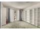 Cozy bedroom featuring carpet, and built-in bookshelves at 13428 N 100Th Ave, Sun City, AZ 85351