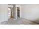 Bedroom view showcasing the ensuite bathroom, closet, and carpeted floors at 13438 N 130Th Ln, El Mirage, AZ 85335