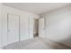 Bedroom features neutral carpet, closet with sliding doors, and access to ensuite bath at 13438 N 130Th Ln, El Mirage, AZ 85335