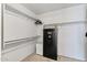 Walk-in closet with carpeted flooring and storage with built-in shelving and safe at 13438 N 130Th Ln, El Mirage, AZ 85335