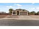 Attractive single-story home with a two-car garage, featuring desert landscaping for minimal upkeep at 13438 N 130Th Ln, El Mirage, AZ 85335