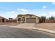 Lovely single-story home with an attached two-car garage and desert landscaping for easy maintenance at 13438 N 130Th Ln, El Mirage, AZ 85335
