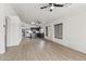 Open concept living room with kitchen featuring stainless steel appliances and granite countertops at 13438 N 130Th Ln, El Mirage, AZ 85335