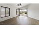 Living room with ample natural light and sliding glass doors leading to the pool area at 13438 N 130Th Ln, El Mirage, AZ 85335