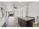 Spacious living room area with neutral tones and kitchen with granite countertops at 13438 N 130Th Ln, El Mirage, AZ 85335