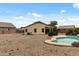 Backyard featuring a refreshing pool surrounded by gravel and some landscaping at 13438 N 130Th Ln, El Mirage, AZ 85335