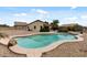Inviting backyard pool featuring rock detail and surrounded by low-maintenance landscaping at 13438 N 130Th Ln, El Mirage, AZ 85335