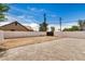 Backyard features a large fenced area with gravel and dirt, offering space and privacy at 1501 E Sheridan St, Phoenix, AZ 85006