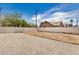 A large backyard with newly laid gravel, a freshly cleared space for your project, and a fence at 1501 E Sheridan St, Phoenix, AZ 85006