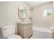Elegant bathroom boasts a stylish vanity, gold fixtures, and tile flooring at 1501 E Sheridan St, Phoenix, AZ 85006
