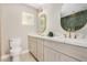 Bright bathroom featuring dual sinks, modern fixtures, and a designer color palette at 1501 E Sheridan St, Phoenix, AZ 85006