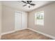 Bedroom featuring wood-look floors, a ceiling fan, and sliding closet doors at 1501 E Sheridan St, Phoenix, AZ 85006