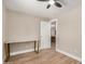 Bedroom area showcases wood-look floors, a marble-top table, and a ceiling fan at 1501 E Sheridan St, Phoenix, AZ 85006