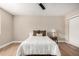 Neutral bedroom with wood-look floors, fan, lamp, and a bright, airy feel at 1501 E Sheridan St, Phoenix, AZ 85006