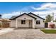 Charming single-story home featuring modern design, xeriscape, and vibrant bougainvillea at 1501 E Sheridan St, Phoenix, AZ 85006
