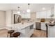 Bright kitchen with white cabinets, quartz countertops, stainless steel appliances, and a large center island at 1501 E Sheridan St, Phoenix, AZ 85006