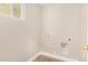 This room features a window and hookups for a washer and dryer at 1501 E Sheridan St, Phoenix, AZ 85006