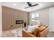 Modern living room featuring a stylish accent wall with electric fireplace and wood floors at 1501 E Sheridan St, Phoenix, AZ 85006