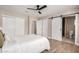 Bedroom featuring wood-look floors and an ensuite bathroom with barn door at 1501 E Sheridan St, Phoenix, AZ 85006