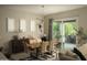 Bright dining area with modern lighting fixture, seamlessly connected to a patio for indoor-outdoor living at 1529 W State Ave, Phoenix, AZ 85021