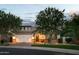 Charming single-Gathering home with manicured lawn, brick accents, and a well-lit, two-car garage at 1529 W State Ave, Phoenix, AZ 85021