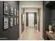Inviting hallway with neutral-toned walls and flooring, enhanced by decorative artwork and natural light at 1529 W State Ave, Phoenix, AZ 85021