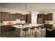 Modern kitchen with stainless steel appliances, an island with seating, and ample countertop space at 1529 W State Ave, Phoenix, AZ 85021