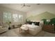 Serene main bedroom with natural light, neutral tones, and a king-size bed for ultimate comfort at 1529 W State Ave, Phoenix, AZ 85021