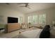 Bright, spacious main bedroom with neutral decor, large windows, and ample space for relaxation at 1529 W State Ave, Phoenix, AZ 85021