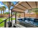 Close-up of a hot tub with a cover, heater, and stairs on a wooden deck at 1565 E Prickly Pear Pl, Casa Grande, AZ 85122