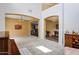 An open floor plan showcasing a seamless blend of living spaces with neutral tones and arched walkways at 1565 E Prickly Pear Pl, Casa Grande, AZ 85122