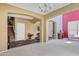 Open floor plan showcasing the living room with neutral paint, high ceilings, and staircase at 1565 E Prickly Pear Pl, Casa Grande, AZ 85122