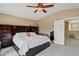 Main bedroom featuring a ceiling fan, a bed, and many dressers at 1565 E Prickly Pear Pl, Casa Grande, AZ 85122
