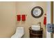 Stylish powder room featuring a modern vessel sink, custom vanity, and decorative mirror at 1565 E Prickly Pear Pl, Casa Grande, AZ 85122
