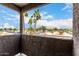 Balcony view showcasing palm trees and a clear blue sky overlooking a busy intersection at 1645 W Baseline Rd # 2098, Mesa, AZ 85202
